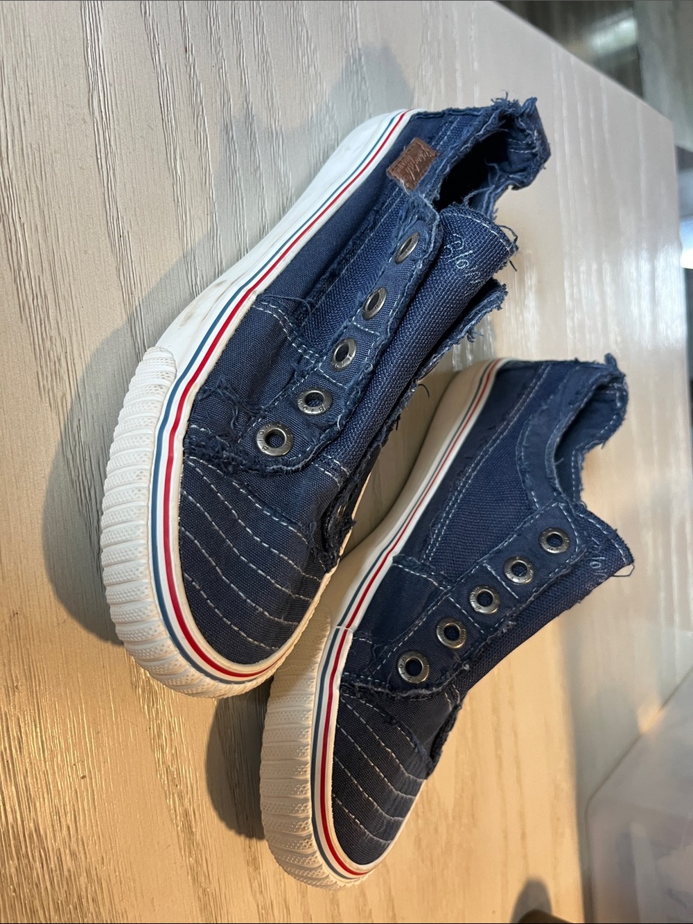 Ladies Navy Canvas Slip-On Sneakers with Red & White Stripe and shoestring holes